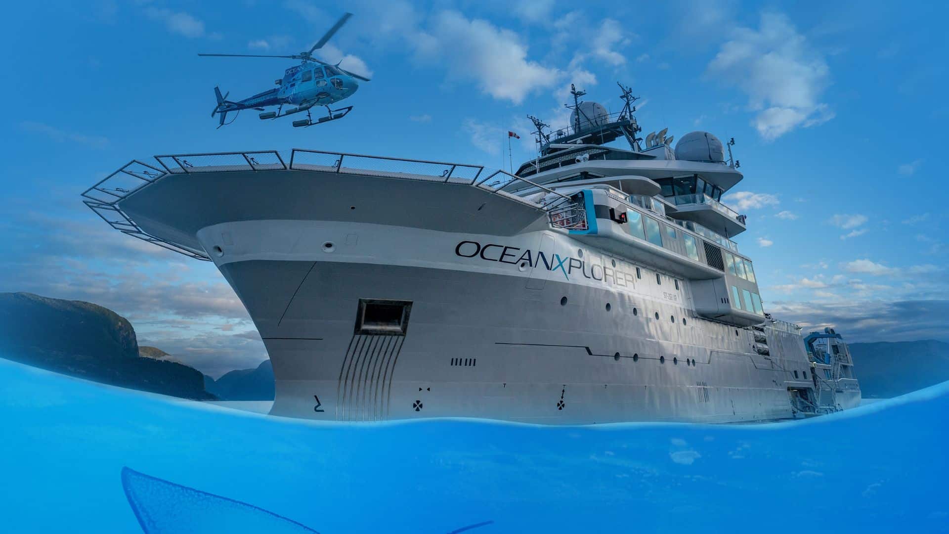 Website Header for OceanXperience featuring a ship at sea.