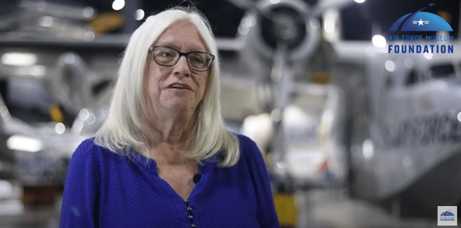 Director, Events Mary Bruggeman in blue shirt in Air Force Museum.